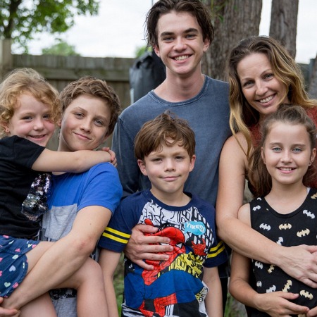 Cameron Caulfield with his siblings and mother.